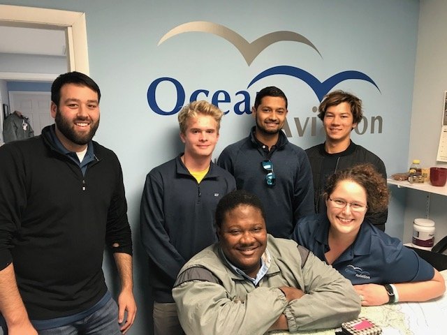Ocean Aviation team and students in office
