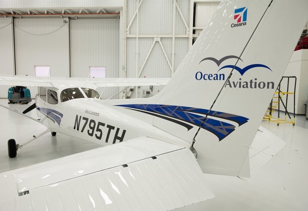 white plane sitting in terminal