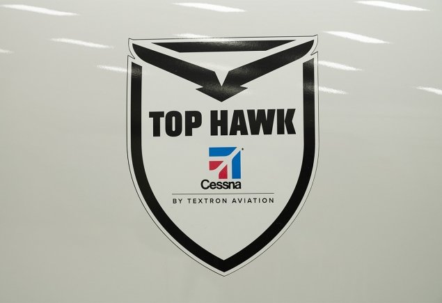 Cessna tophawk on plane side