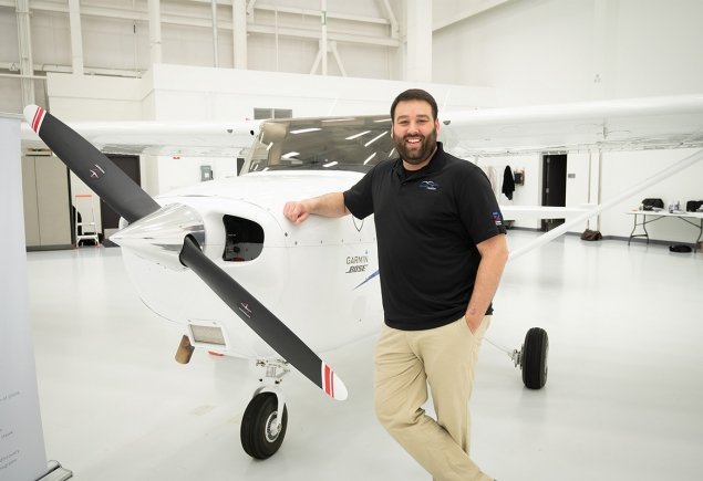 Man leaning against plane 