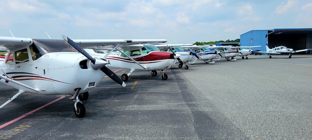 Multiple airplaines at hangar